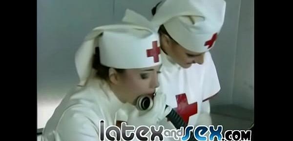  Latex nurses treat a rubber gas mask guy